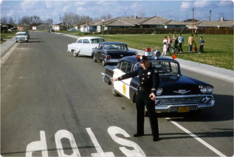 1960s Police Officer directing traffic